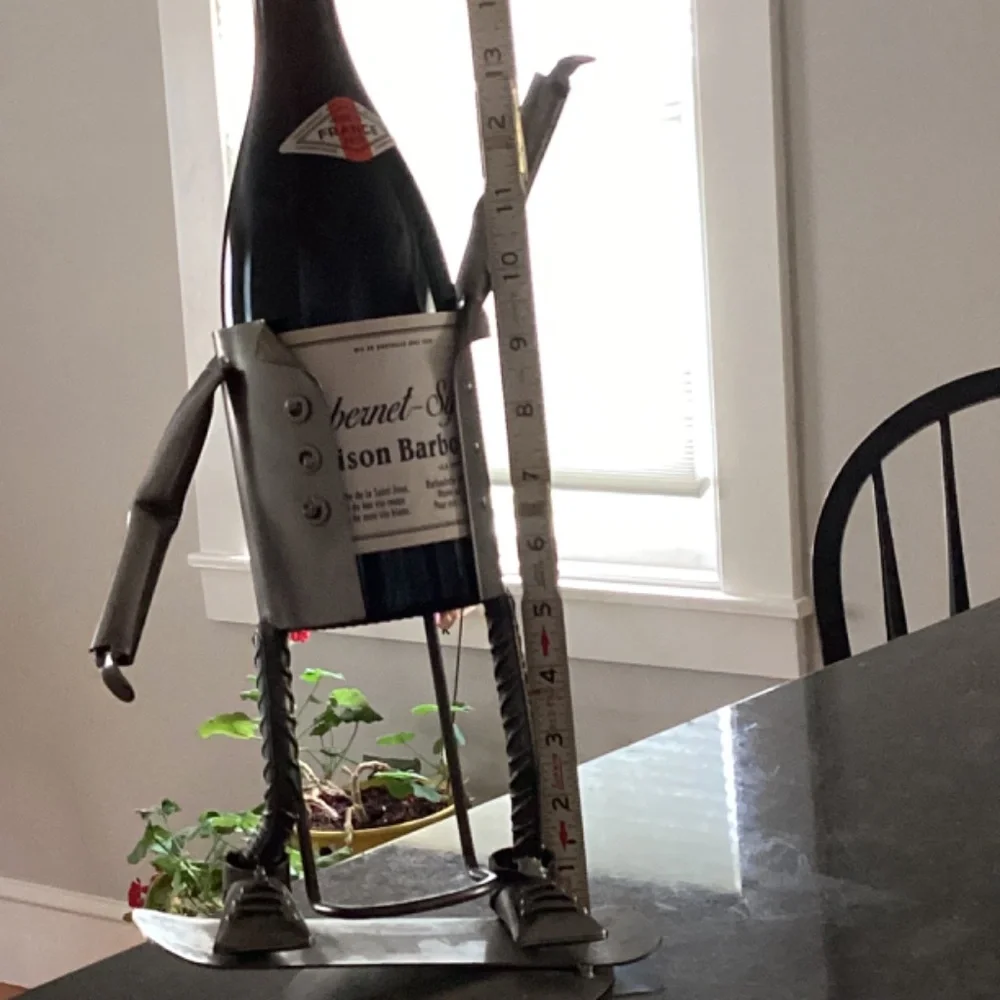 Wine bottle holder H & K steel on person on Skateboard?